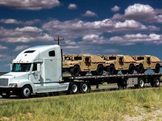 semi-truck-hauling-military-vehicles